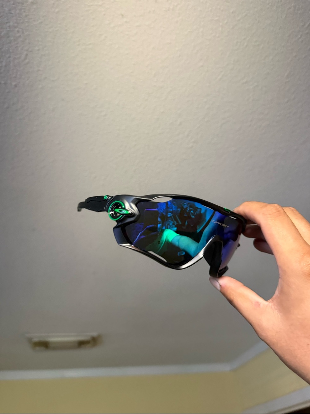 Black Sunglasses with Blue-Green Mirrored Lenses Oakley